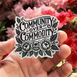 Community Over Commodity - holographic sticker